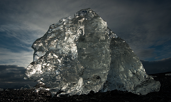 Backlit iceberg stranded on a black sand beach©2013 Bob Harvey